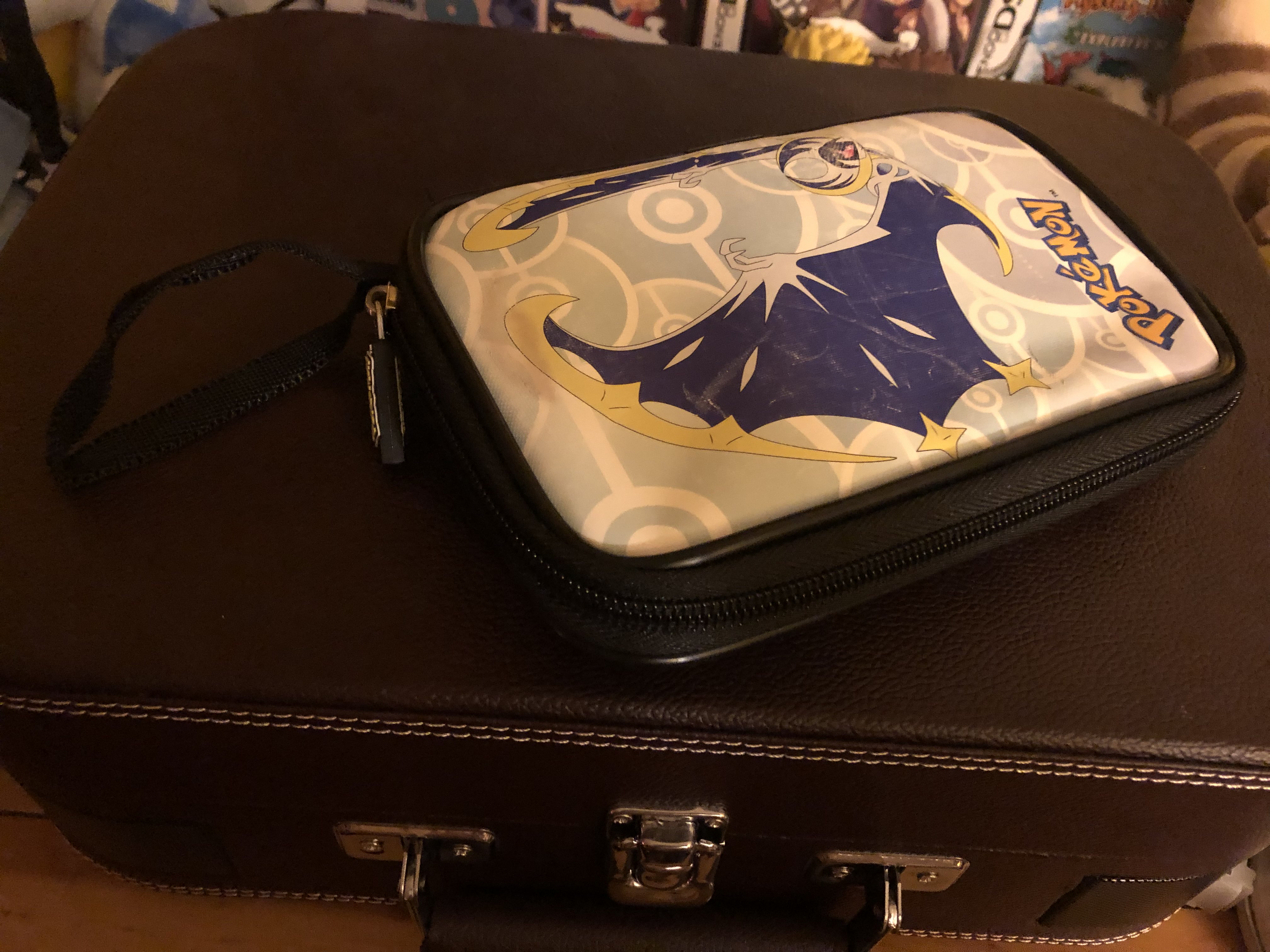 a photo of my lunala 3ds case with a wrist strap.